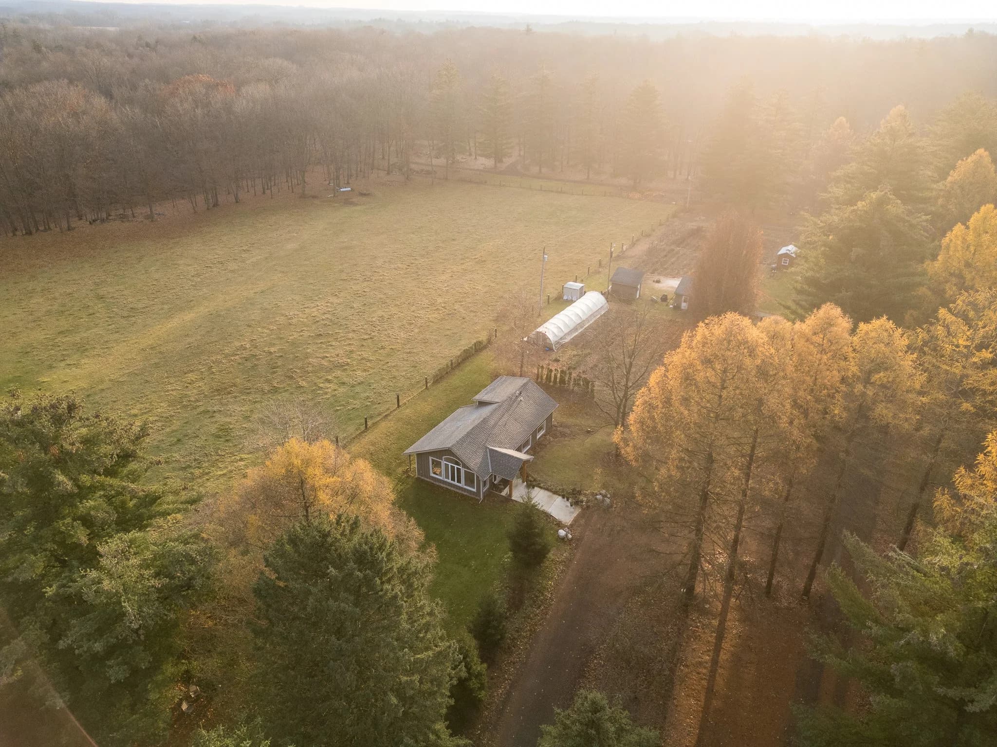 Aerial view of the Studio Loft at Fernwood Hills surrounded by trees and meadow